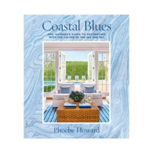 Book cover of "Coastal Blues" by Phoebe Howard, featuring a blue marbled border and a photo of a bright, coastal-themed living room with decorative books and open doors to a pool and lawn.