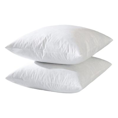 Two stacked white pillow inserts rest against a plain background, offering a simple yet inviting display.