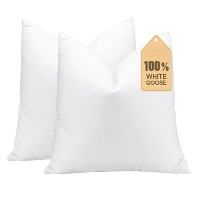 Two white pillows with a tag reading 