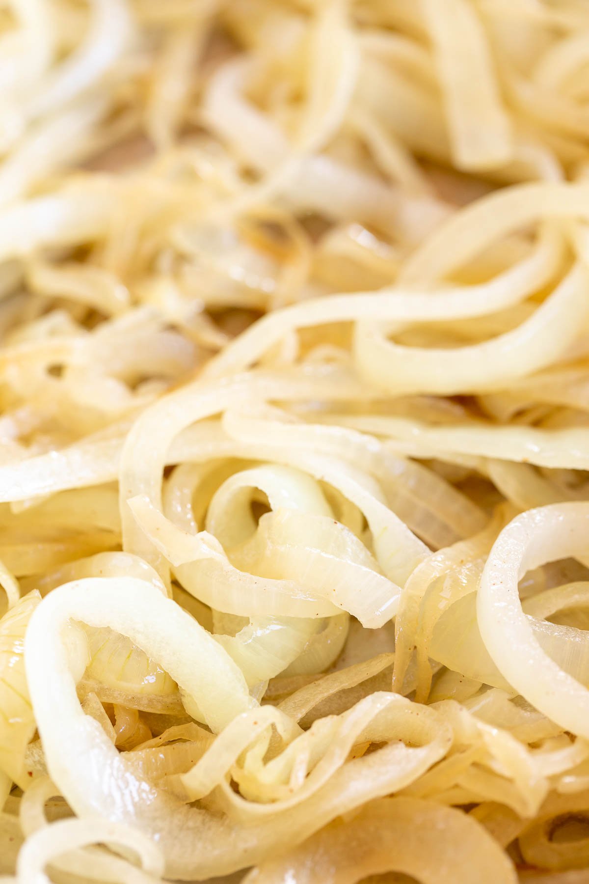 Sliced onions in a pan, for a guide on how to cut an onion.