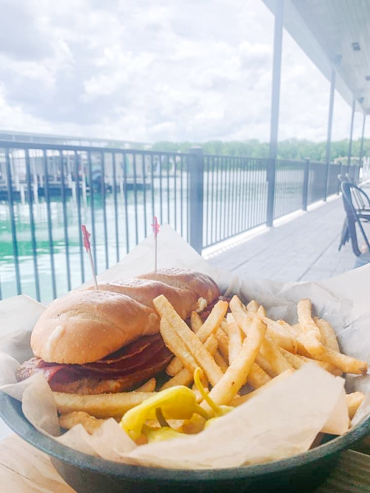 sandwich and fries on dock on table rock lake
