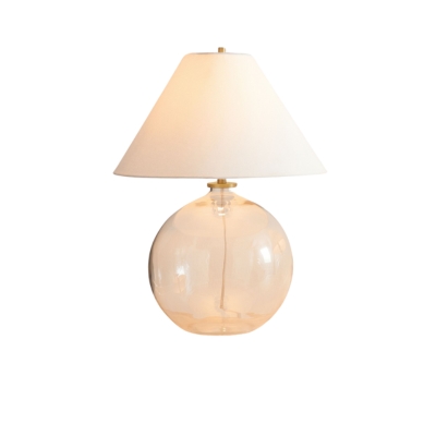 A clear glass table lamp with a white shade offering a pottery barn look for less.