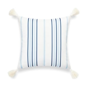 A blue and white striped pillow with tassels, similar to Serena & Lily dupes.