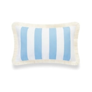 A blue pillow with fringe trim, reminiscent of Serena and Lily dupes.