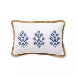 A blue and white pillow with fringes, possibly inspired by Serena and Lily dupes.