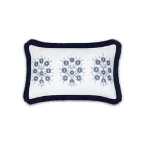 A blue and white embroidered pillow with fringes, similar to Serena and Lily dupes.