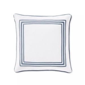 A white and blue pillow with a blue trim, similar to Serena and Lily dupes.