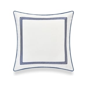 A white and blue pillow with a blue trim, reminiscent of serena and lily dupes.