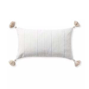 Get the Serena and Lily look for less with this blue and white striped pillow featuring tassels.