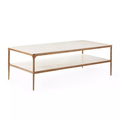 Achieve the Serena and Lily look for less with this white coffee table featuring brass legs and a marble top.