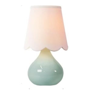 A small table lamp with a glossy, light blue ceramic base and a white lampshade with a scalloped edge—perfect for brightening up your guest room.