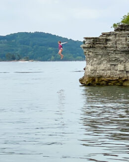 kid jumping off cliff
