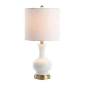 White ceramic table lamp with a rounded base, gold accents, and a cylindrical white fabric lampshade—perfect for adding an elegant touch to any guest room, shown against a plain background.