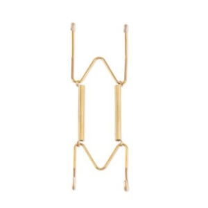 A gold-colored metal orthodontic appliance with two central bars and four wire extensions, arranged symmetrically on a white background, resembling miniature plate hangers.