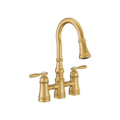 A gold bridge kitchen faucet with two handles on a white background.