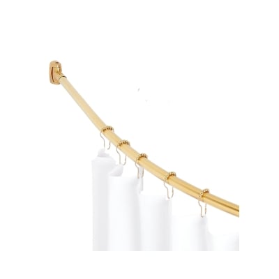 A brass shower curtain rod with a white curtain hanging from it.
