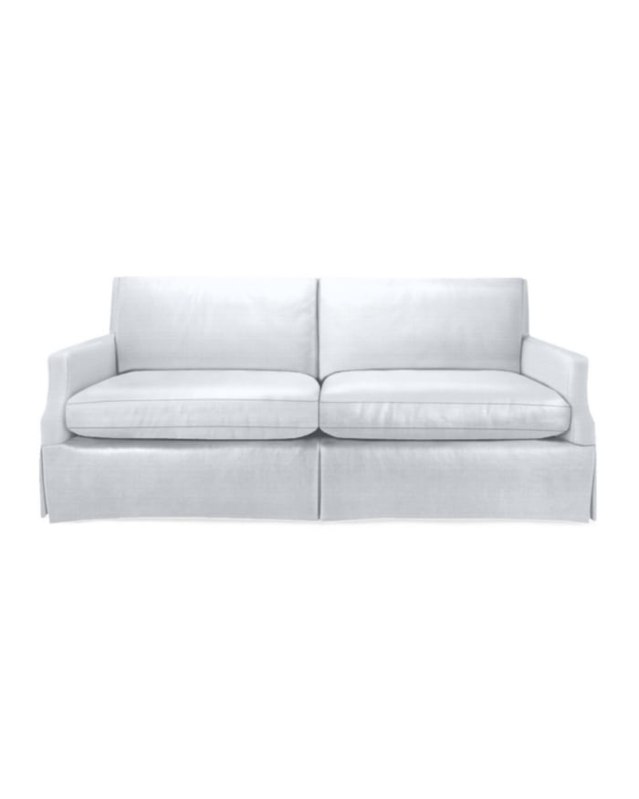 A white Serena and Lily Grady skirted sofa
