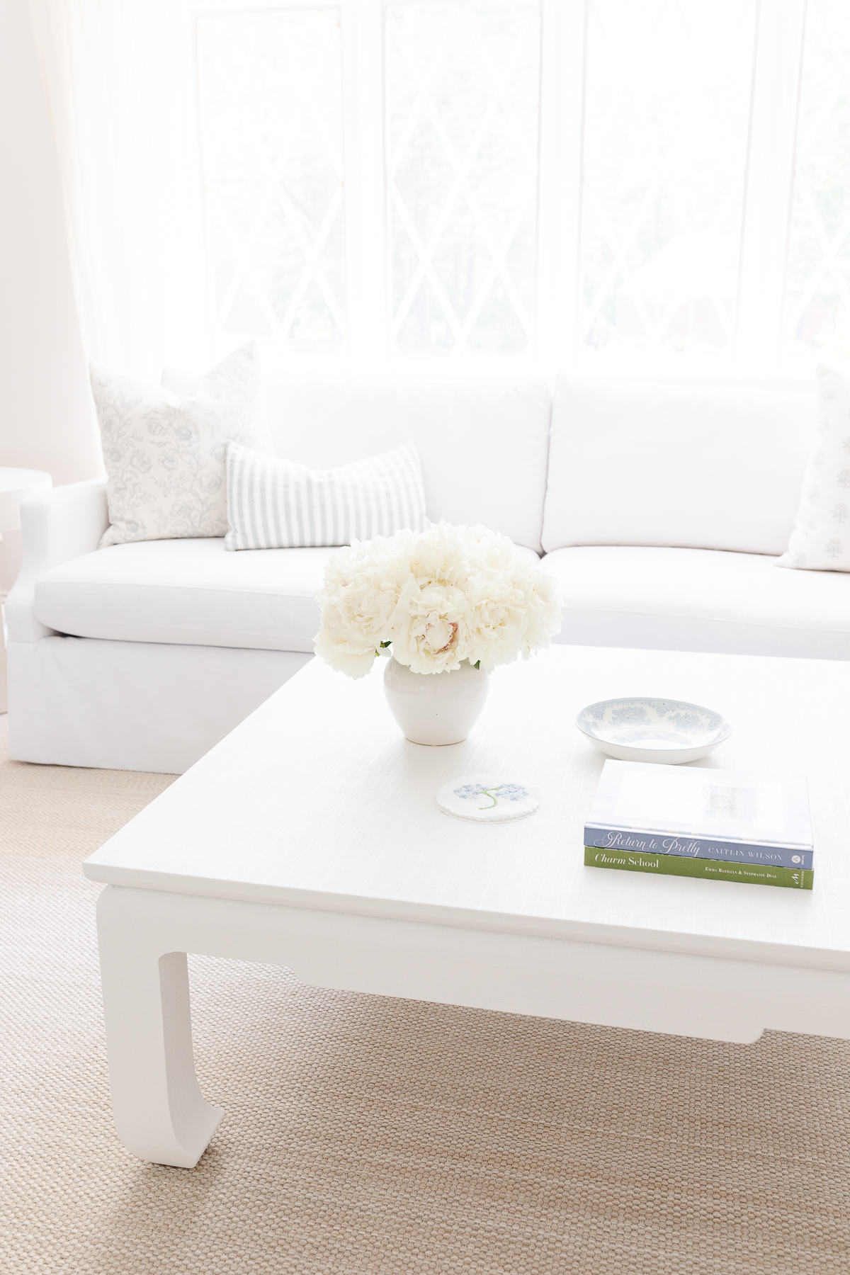 A white Serena and lily Grady sofa in a white living room. 