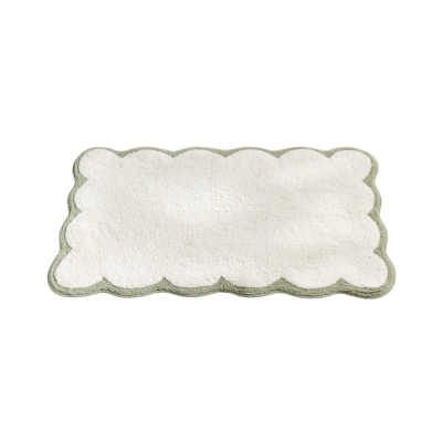 A white and green scalloped bath mat from Julia Berolzheimer for Target