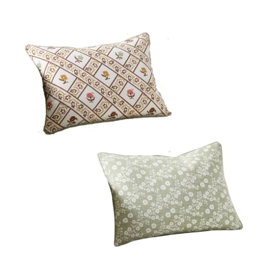 A patterened pillow from Pottery Barn that is reversible