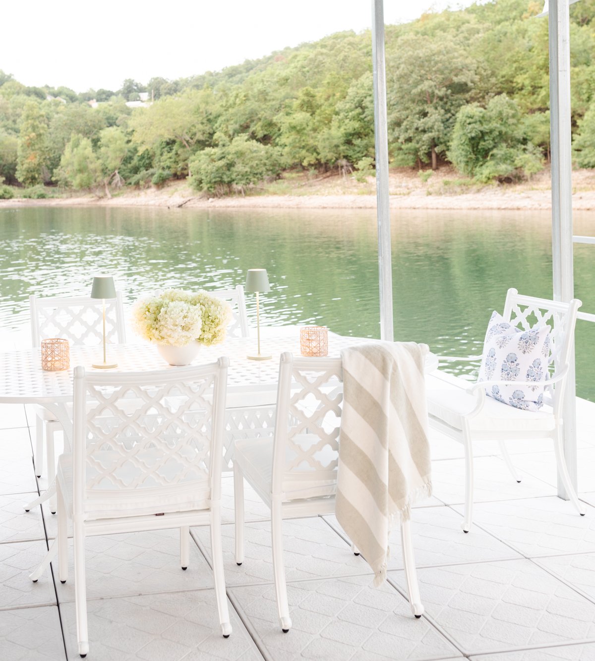 white outdoor furniture on a dock
