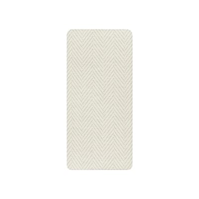 A white chevron pattern on an anti fatigue kitchen mat.