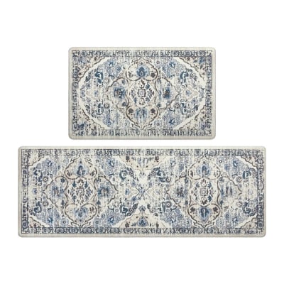 Two ornate blue and white anti-fatigue kitchen mats.