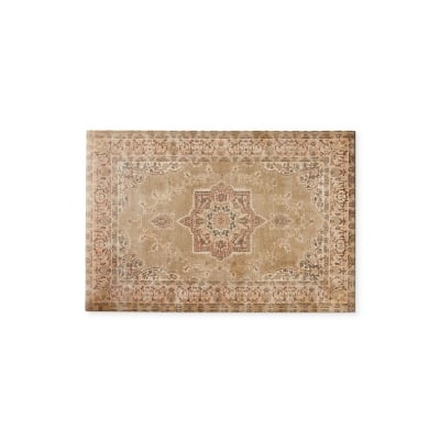 A beige area rug with an ornate design suitable for kitchens.