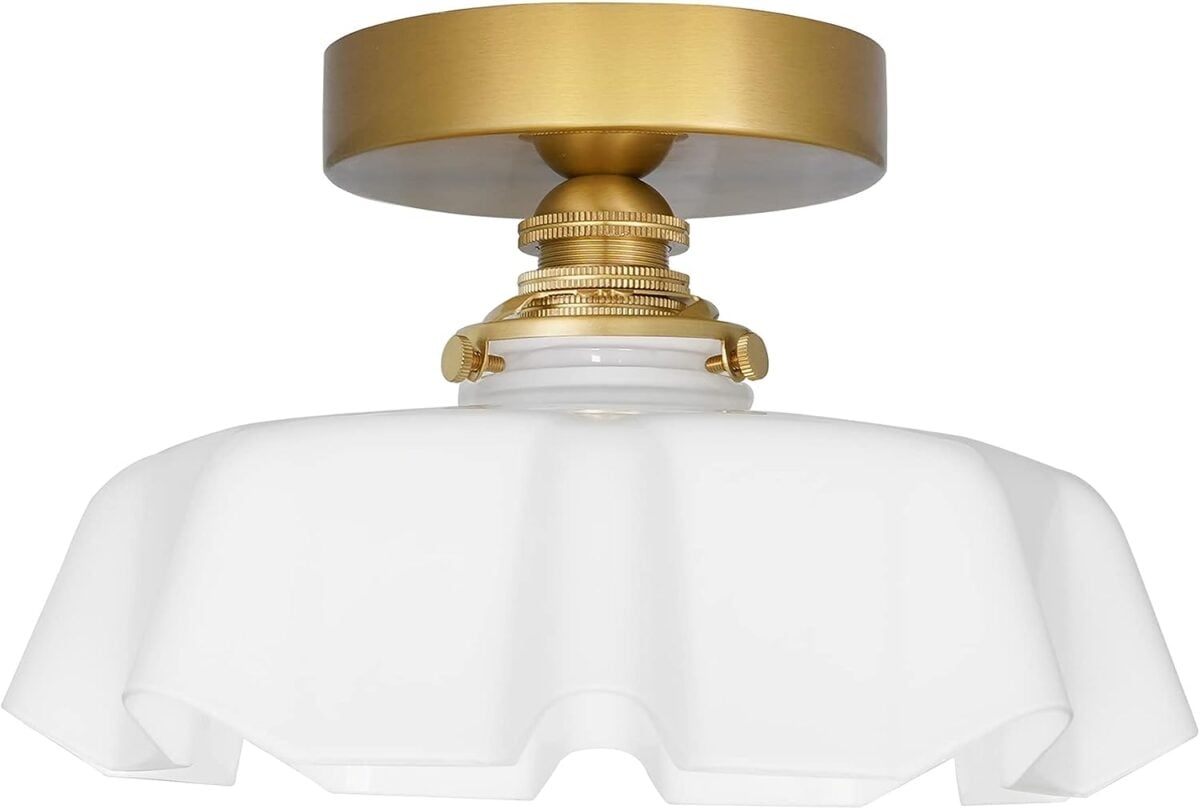 A gold and white ceiling light featuring a glass shade for Prime Day.