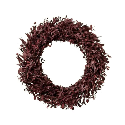 A circular wreath made of dark red leaves, arranged densely and evenly, with an empty center—perfect for those seeking elegant fall wreaths.