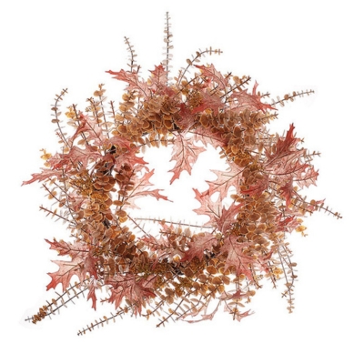 A fall wreath made of dried leaves and twigs.