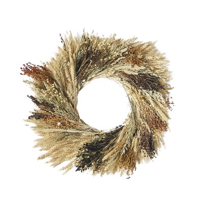 A fall wreath made of dried grass on a white background.