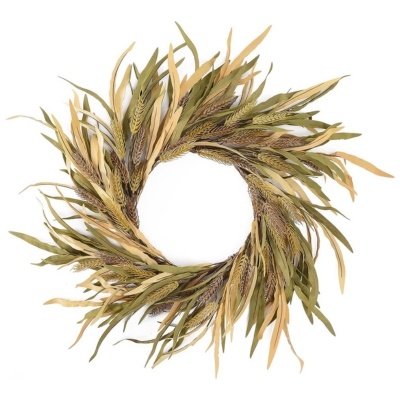 A fall wreath made of dried grasses on a white background.