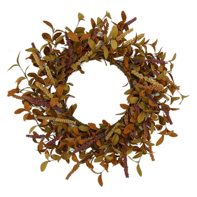 A fall wreath with leaves and twigs on a white background.
