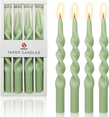 A set of green taper candles on prime day.