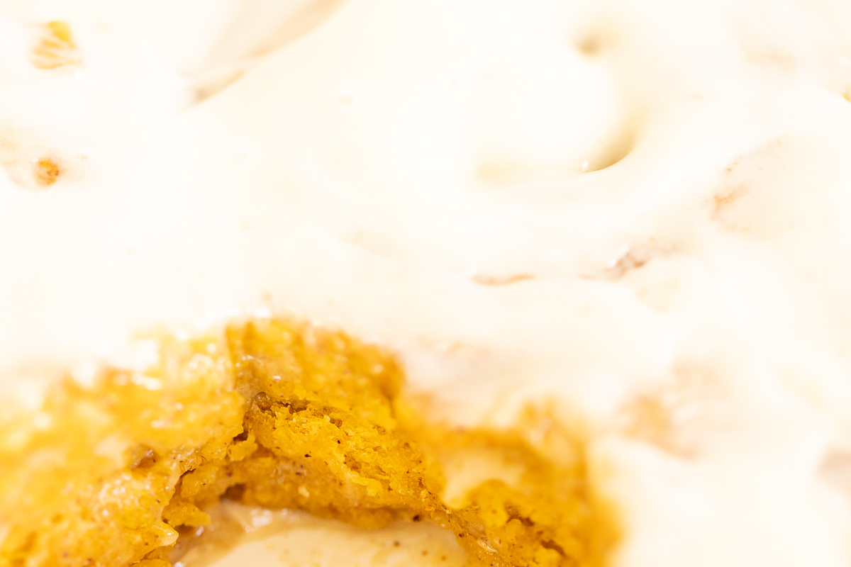 A mouthwatering close up of a Pumpkin Cinnamon Roll.