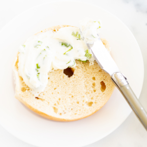 A bagel with scallion cream cheese.
