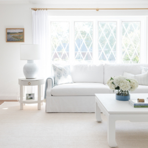 A white Serena and Lily sofa in a white living room.