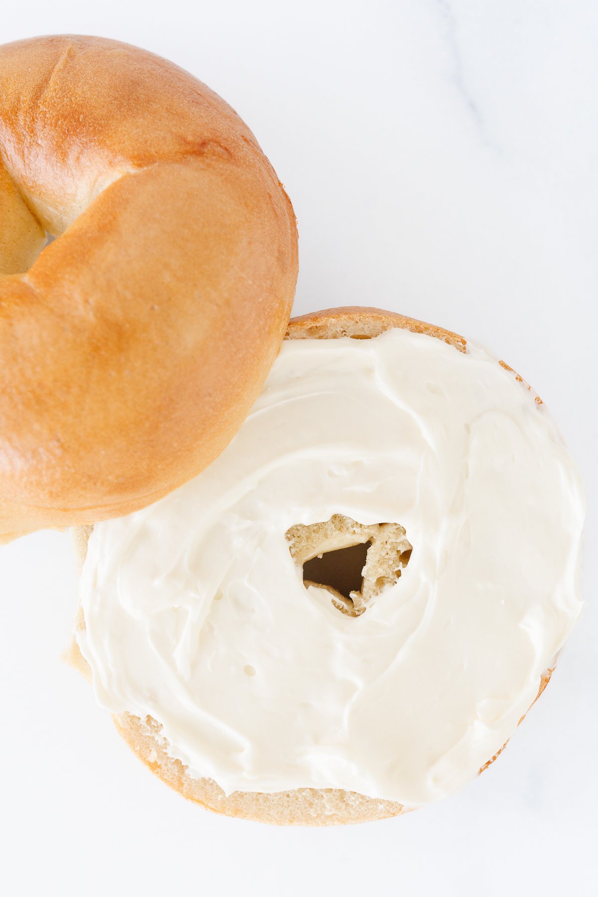 Thick bagel smothered in whipped cream cheese.