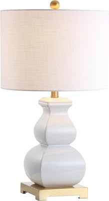A white and gold table lamp available on prime day.
