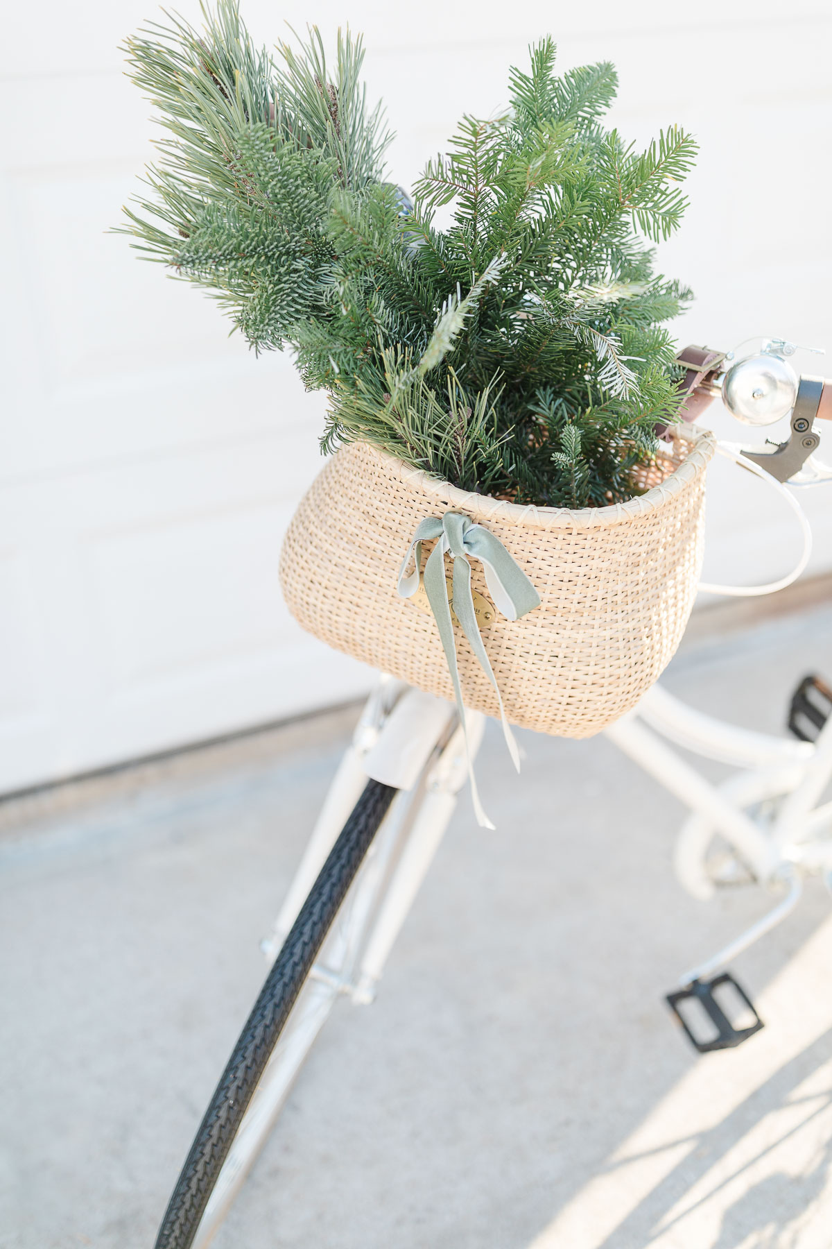 In celebration of Cyber Monday, a festive wicker basket on a bicycle showcases a charmingly decorated Christmas tree.