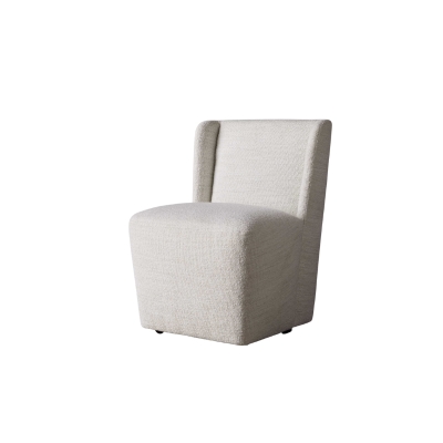 A white upholstered chair against a white background, offering an Arhaus look for less.