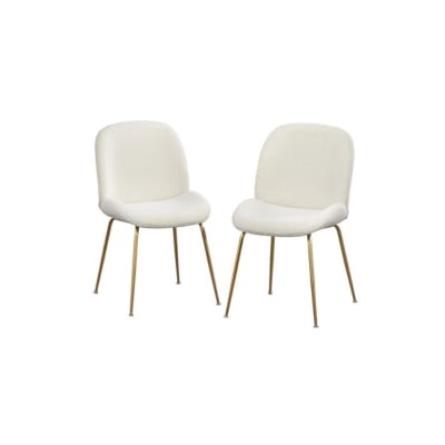 Two white chairs with gold legs, offering a look for less alternative to Arhaus.