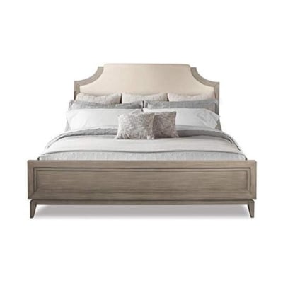 An arhaus inspired bed with a wooden headboard and footboard, offering a stylish look for less.