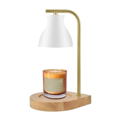 A candle on a wooden stand with a light on it.