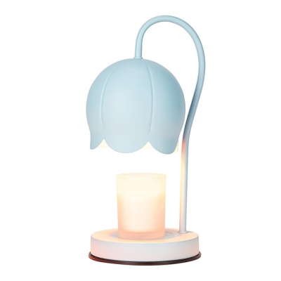 A blue lamp with a candle on it.