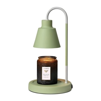 A green lamp with a candle on it.