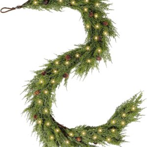A cedar garland intertwined with pine needles and adorned with pine cones, creating a festive Christmas decoration.