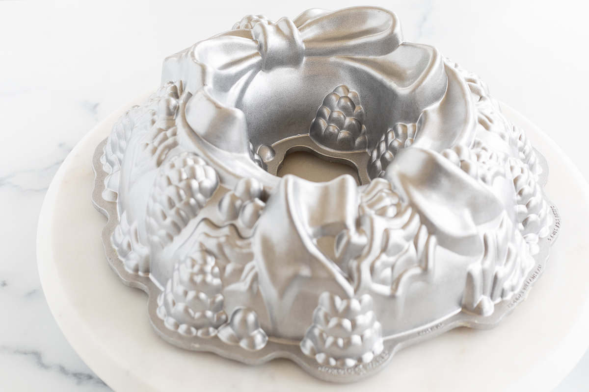 A Christmas Bundt Cake with a silver bow on top.