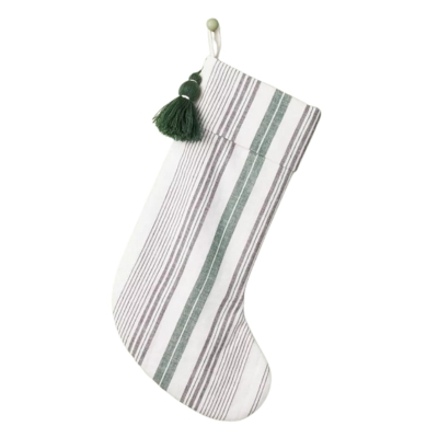 A white and green striped christmas stocking with a tassel.